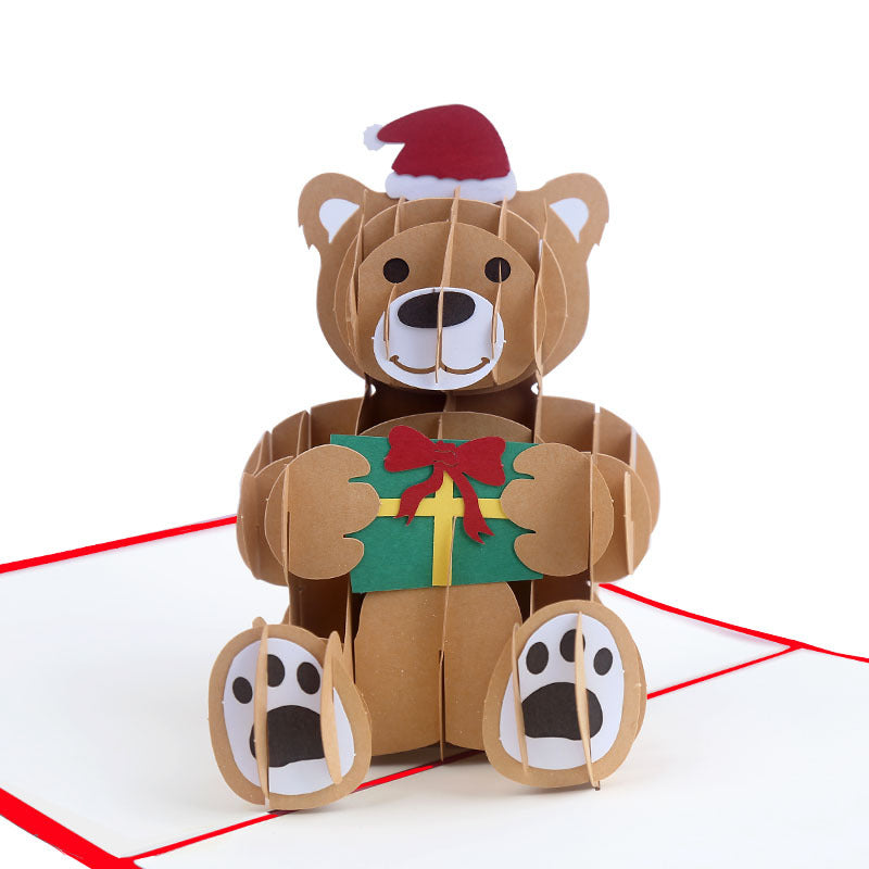 Beer met kerstmuts en cadeautje pop up kaart